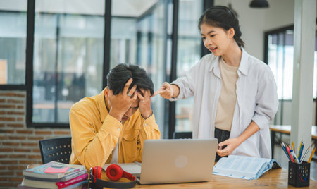Young students quarrel when their work fails and goals are not met. , communication does not understand each otherの写真素材