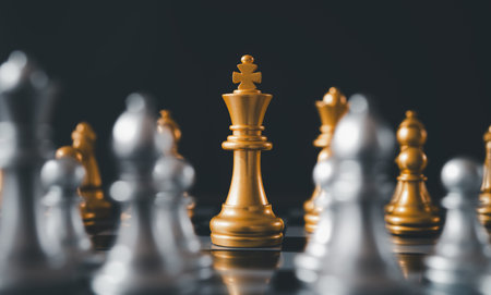 King golden chess standing confront of the silver chess team.chess board game concept of business ideas and competition and stratagy plan success meaningの写真素材