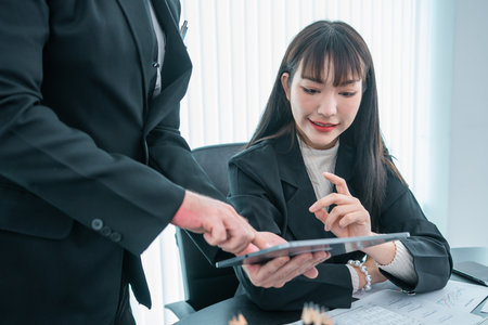 business women and men discussing project planning and business analysis, financial planning, working on marketing research,の写真素材