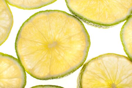 Fresh lime slices on whiteの写真素材