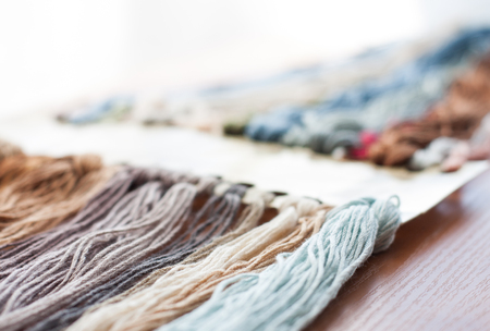 Close up set of colorful wool threads. Abstract hobby background