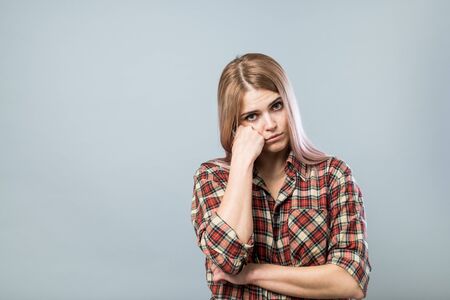 Young cute woman in sadnessの写真素材
