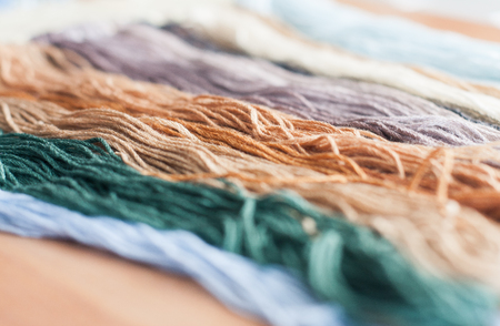Close up set of colorful wool threads. Abstract hobby background