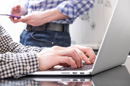 Colleagues interact during their workflow