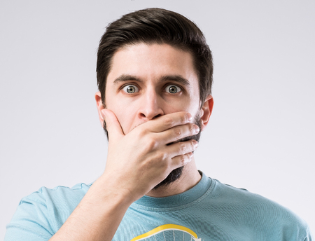 Portrait of bearded man with amazed or scared emotion on face
