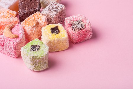 Eastern various colorful sweets on pink backgroundの写真素材