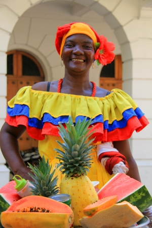 A woman selling fruit at a market in Cartagena, Columbia  Date  16 Dec  2012  No model release available  Editorial use only のeditorial素材