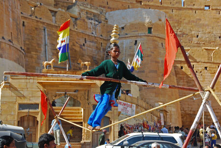 A young girl performing on a tightrope on the streets in Jaisalmer, India 31 Dec 2008 No model release Editorial use onlyのeditorial素材