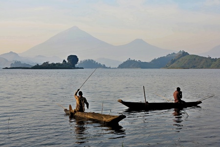 Men fishing in river on log boat