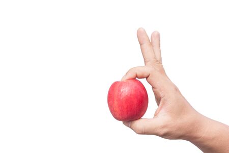 Apple in hand isolated on white backgroundの写真素材