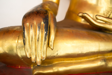 Right Hand of Old Gold Buddha statue sit cross legged.の写真素材