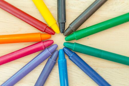 Crayon on wood background with copy spaceの写真素材