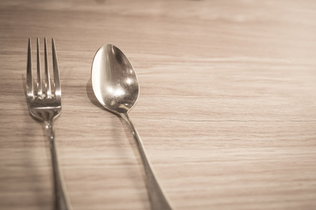 Spoon and Fork shallow focus vintage brown tone.の写真素材