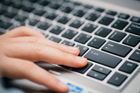 Hand with keyboard focus on Shift Key.