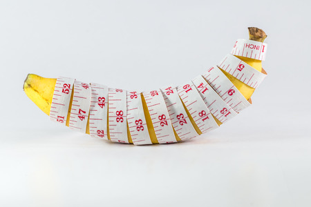 banana with measurement tapeの写真素材