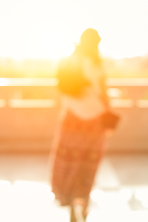 Blur Women walk away left behind concept.の写真素材