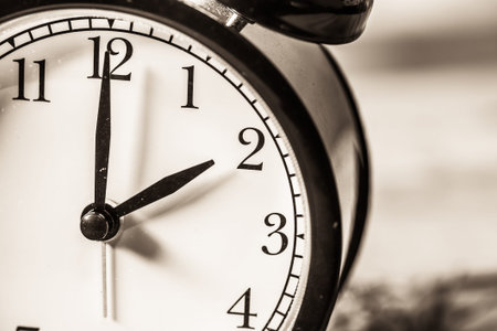 Retro vintage clock on sack closeup at 2 o'clock