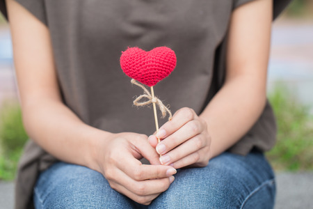 women heart giving love in women her hand hold.の写真素材