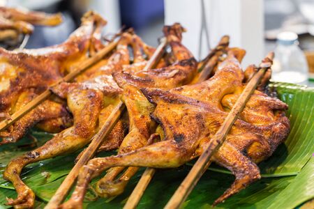 chicken grilled BBQ sale in the market in Thailandの写真素材
