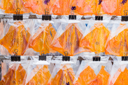 Dried sweet stingray orange color for sale grill eat at street food snack.の写真素材