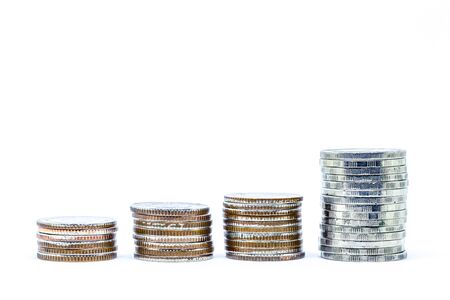growing money and grow business. silver coin stack isolated on whiteの写真素材