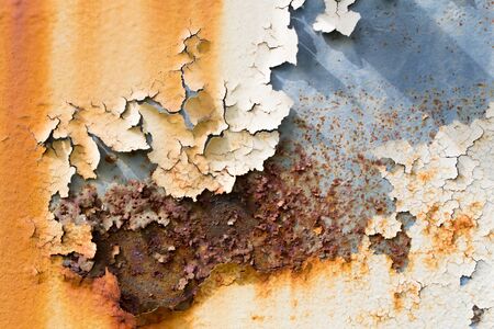 metal iron rust with peeling paint background and textureの写真素材
