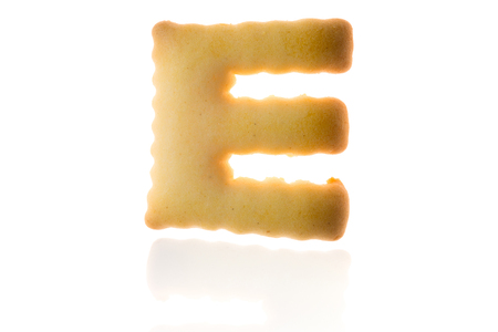Letter E Cookie Biscuit english capital font isolated on white with path.の写真素材