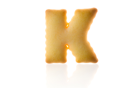 Letter K Cookie Biscuit english capital font isolated on white with path.の写真素材