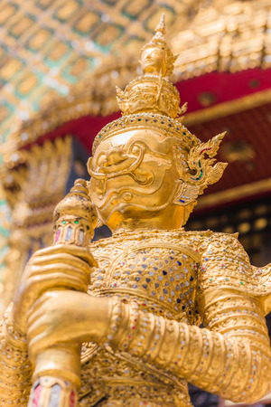 Closeup beautiful Golden Giant in Wat Phra Kaew or the Temple of the Emerald Buddha or Wat Phra Sri Rattana Satsadaram, Bangkok Thailand.の写真素材
