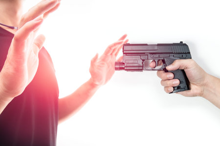 Robber with a gun robbing intimidate a man surrender. Isolated white background. Bandit steals from...