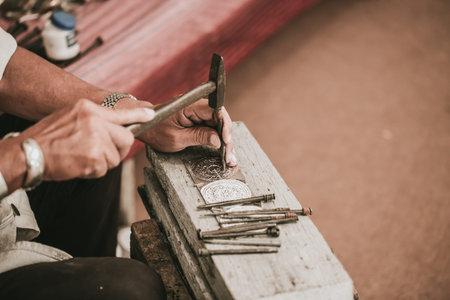 North Thai senior artist handcraft carver silver with hammer and chisel for culture style silver art...