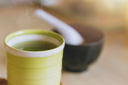 Matcha Japanese healthy drink. Hot Green tea drinking after food meal for good health.の写真素材