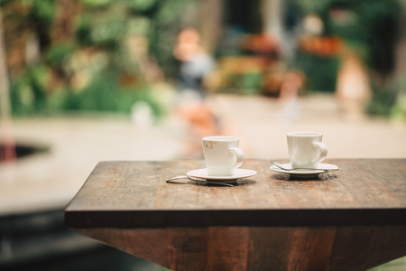 coffee in the morning, two cup of espresso on wood table in cafe or coffeeshop.の写真素材