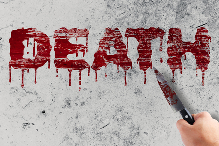 death blood for halloween with hand hold bloody knife of murder or killerの写真素材