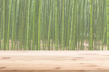 Wood foreground with blur bamboo wood forest background design for display nature productsの写真素材