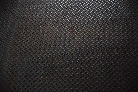 shiny old grunge metal steel pavement plate pattern from a manhole coverの写真素材