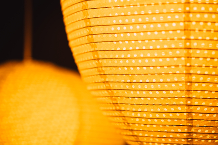 closeup night lighting paper lamp in festival street decoration backgroundの写真素材