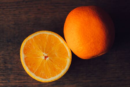 orange sliced on wood background dark toneの写真素材