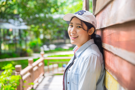 portrait cute young innocent asian teen smile hapy expression with good healthy dentalの写真素材