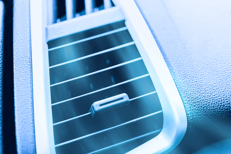 car air conditioner close up air grill air ventilation with cool fresh air blowing outの写真素材
