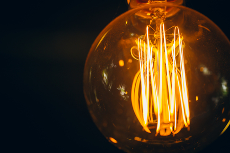 light bulb closeup vintage retro style with space for textの写真素材