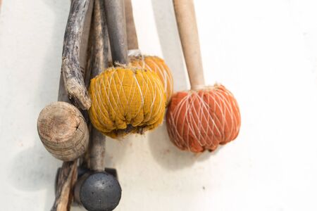 Gong mallet on white wallの写真素材