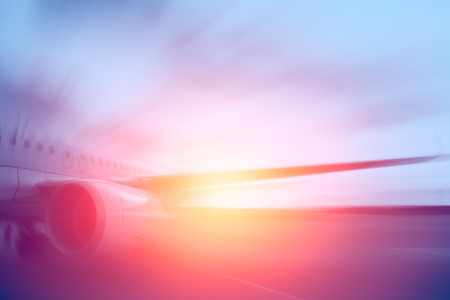 air plane, aircraft jet engine motion blur with sunny for backgroundの写真素材