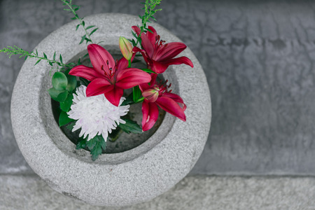 beautiful Lilies flower decoration in stone potの写真素材
