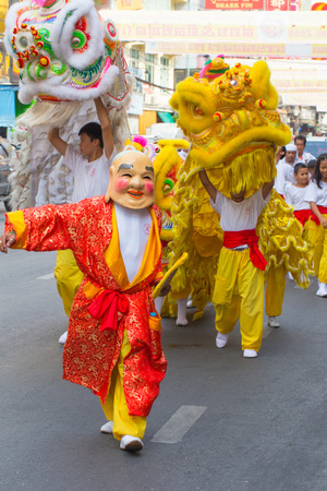 Happy chinese new year Joker People with Chinese Dragon Dance Asian Arts Festival in China town in Bangkok August 2016.のeditorial素材
