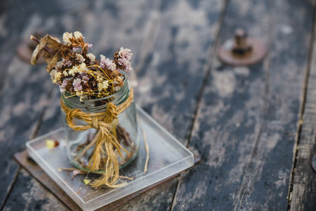 dried flower cafe decoration on old wooden tableの写真素材