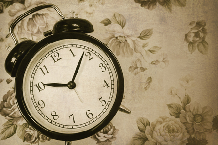 Vintage classic clock in retro old art with space for text and grunge textureの写真素材