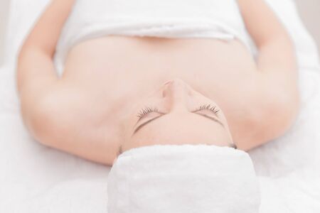 Young woman relaxing at health spa massageの写真素材