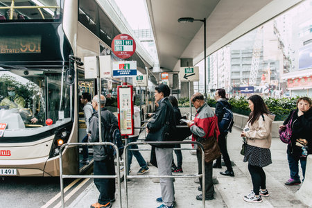 Public Bus station in Hong Kong with line queue of people waiting on the street most hongkong people...