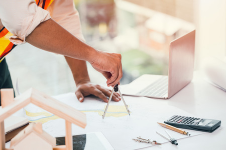 landscape engineering using Geometric compasses on the land mapの写真素材